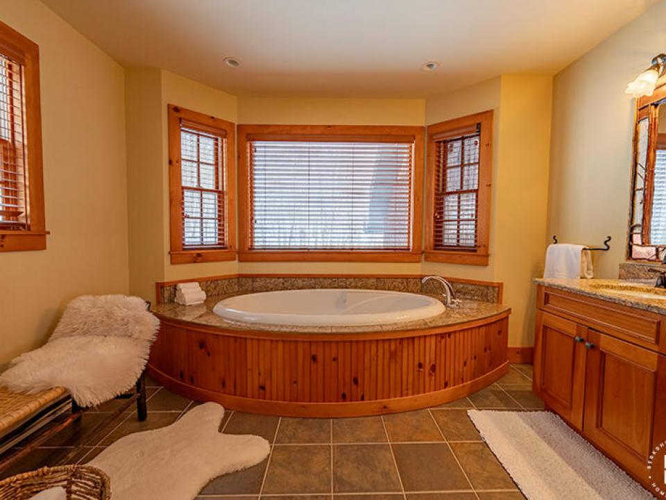 CustomBuiltADKHomeOnOverlook_Bedroom1_Ba