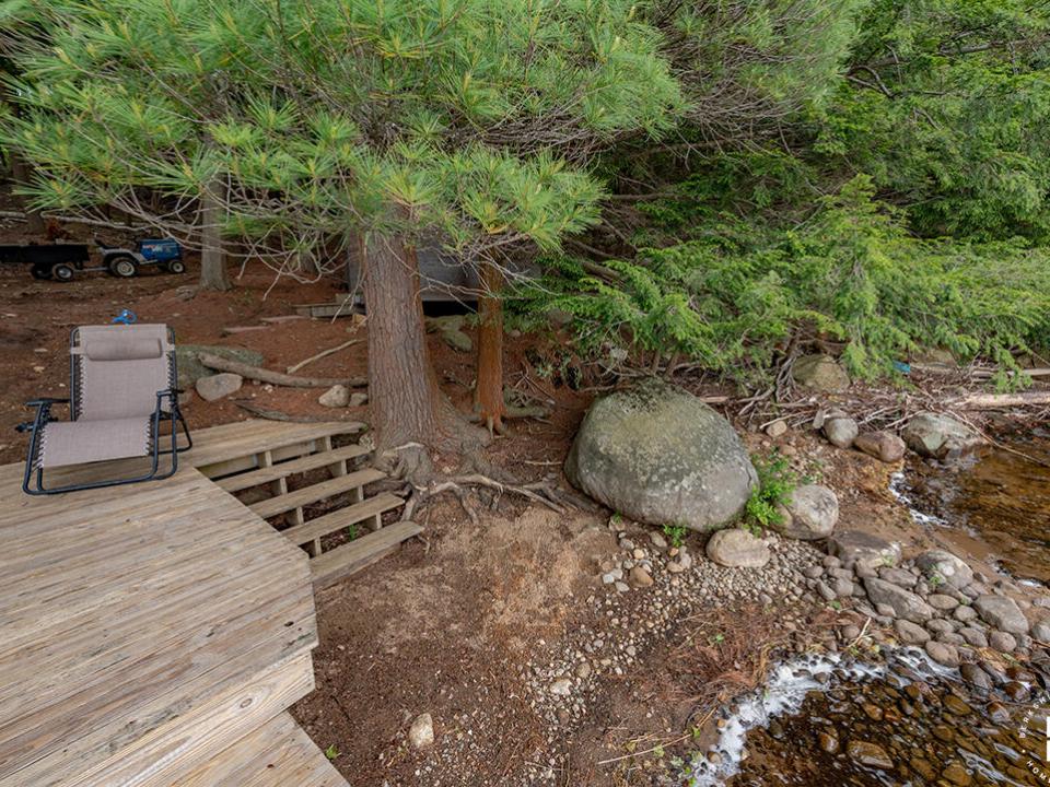 CampBassRockOnTupperLake_SandyBeachFront