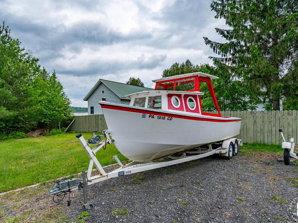 CampBassRockOnTupperLake_TugBoat_Front