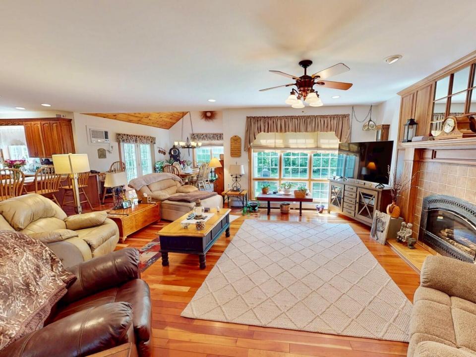 Family room open to sunroom and kitchen