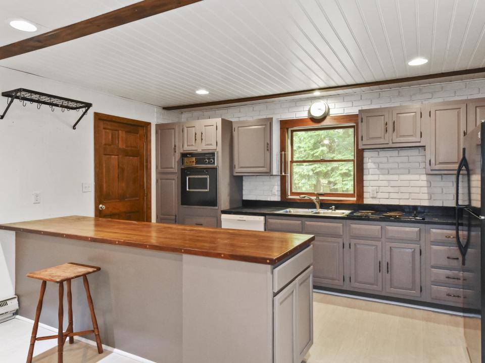 Kitchen has entrance to attached garage