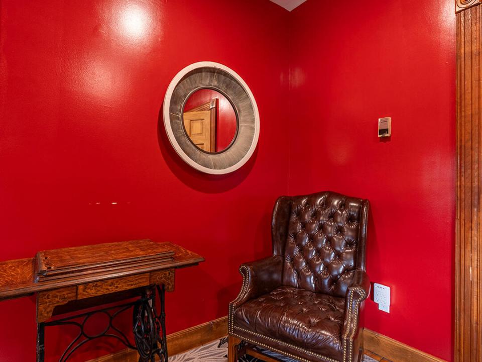 BeaverChalet_Fall25_Bedroom_Red_Chair_V