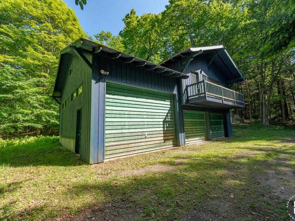 AdkCompoundOnUpperSaranac_Garage_Exterio