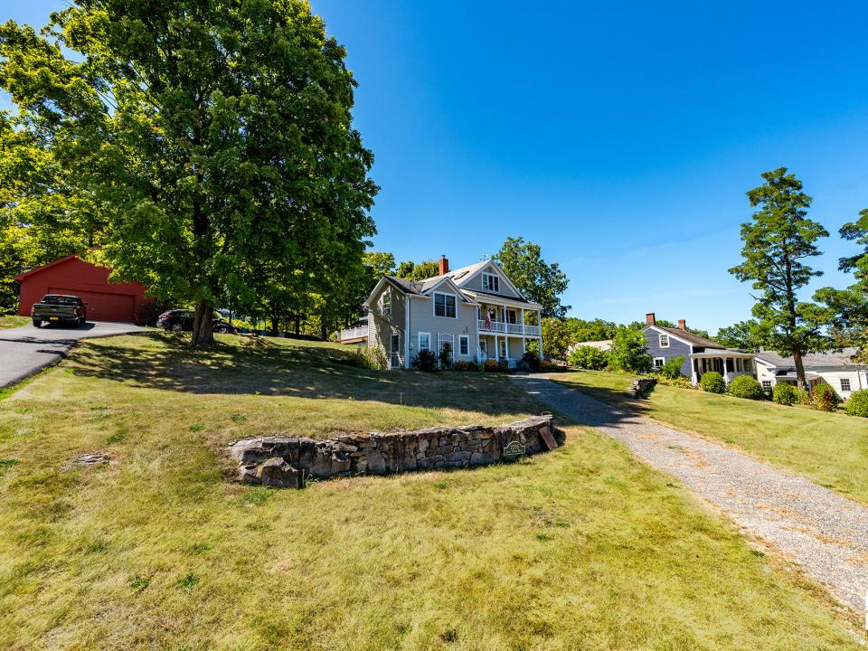 EssexHomeWithLakeViews_Exterior_From_Roa