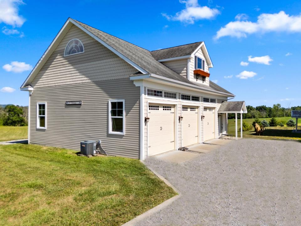3 car garage with cottage above